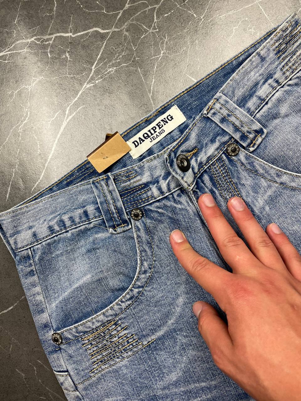 DAQIPENG light blue denim skirt with contrasting black stitching and vintage patch detail.