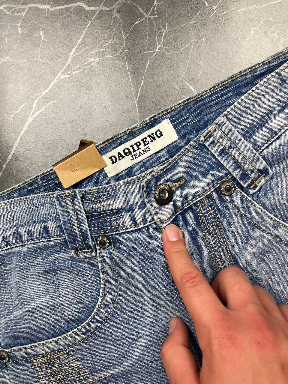 DAQIPENG light blue denim skirt with contrasting black stitching and vintage patch detail.