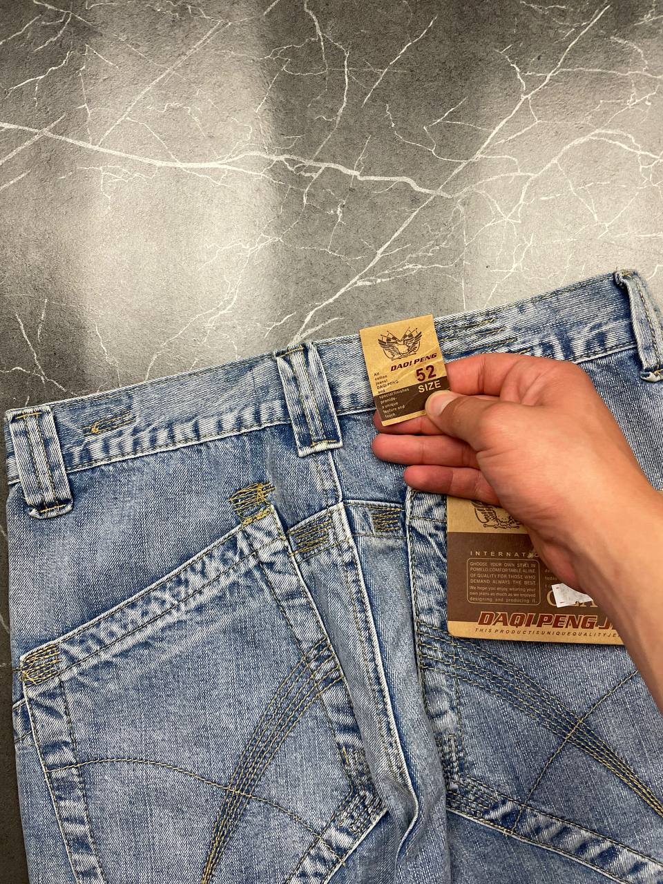 DAQIPENG light blue denim skirt with contrasting black stitching and vintage patch detail.