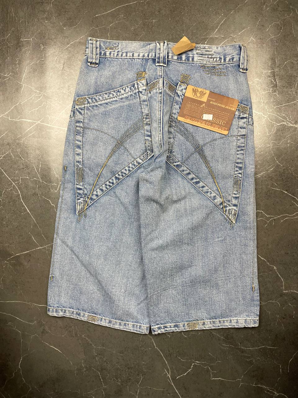 DAQIPENG light blue denim skirt with contrasting black stitching and vintage patch detail.