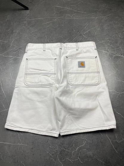 Carhartt white shorts with contrasting black stitching and classic logo patch.
