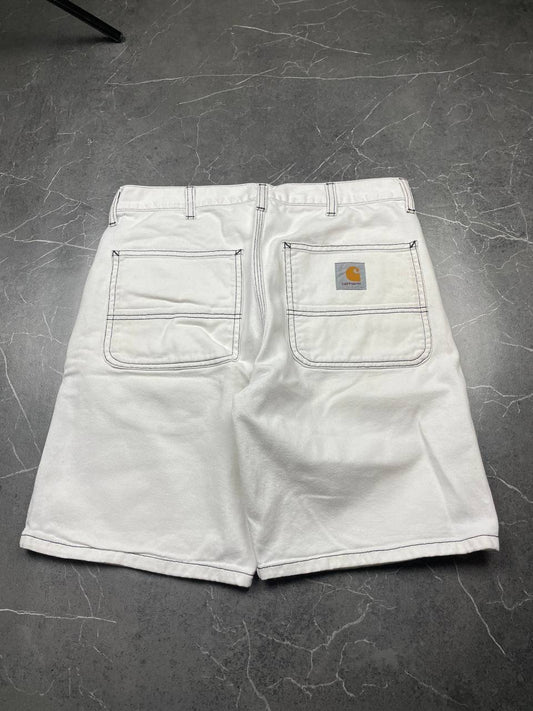 Carhartt white shorts with contrasting black stitching and classic logo patch.