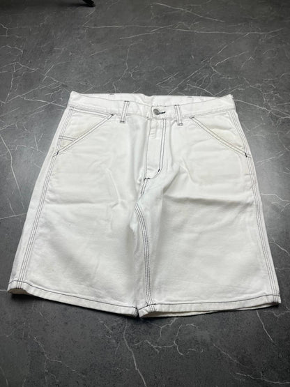 Carhartt white shorts with contrasting black stitching and classic logo patch.