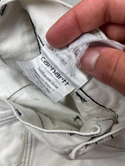Carhartt white shorts with contrasting black stitching and classic logo patch.
