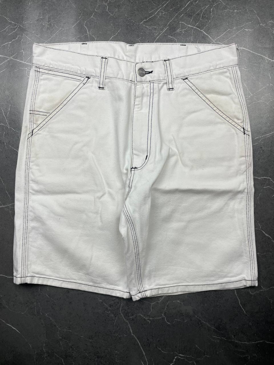 Carhartt white shorts with contrasting black stitching and classic logo patch.