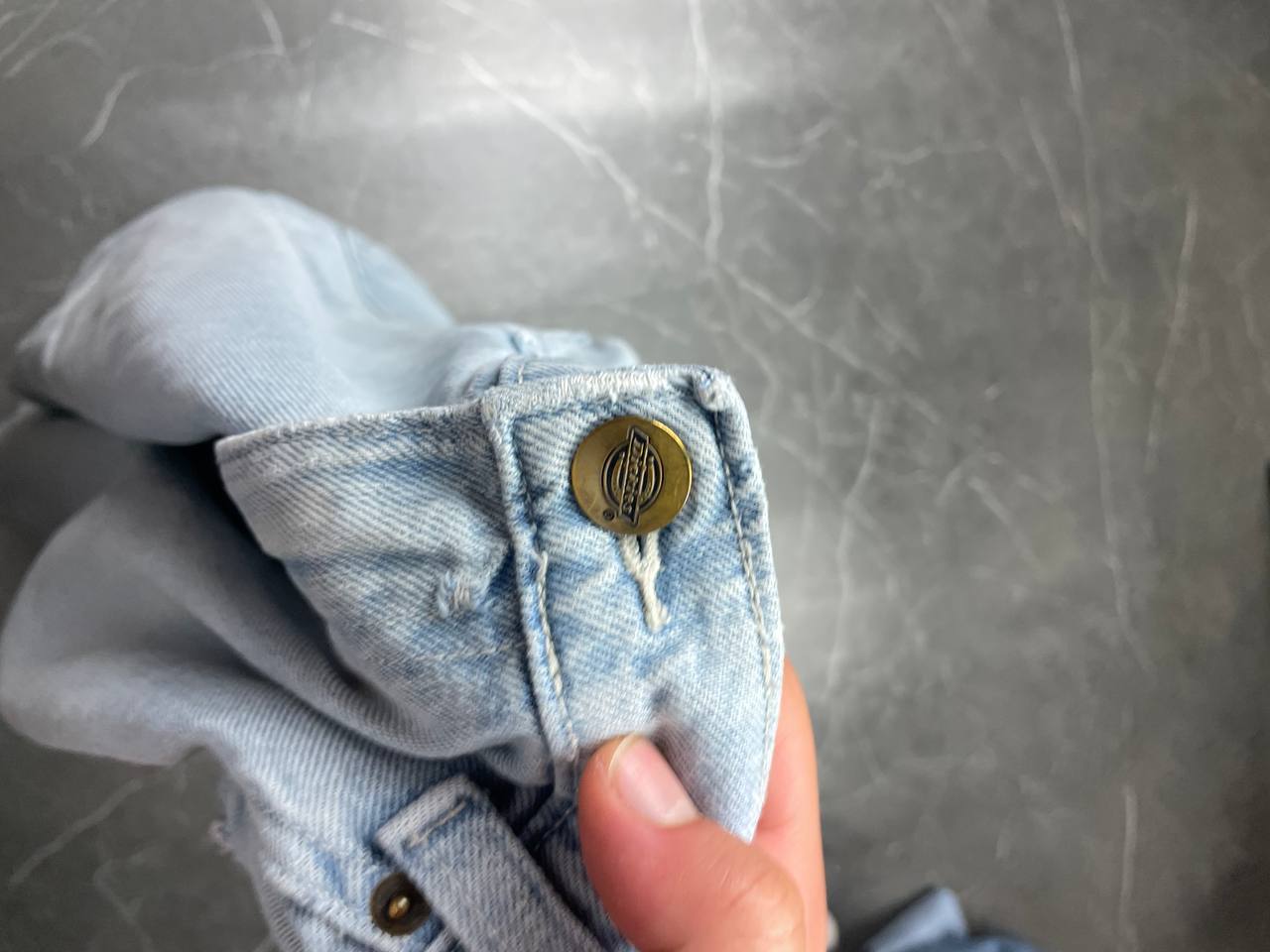 Dickies light blue denim carpenter shorts with logo button, multiple pockets, and hammer loop.
