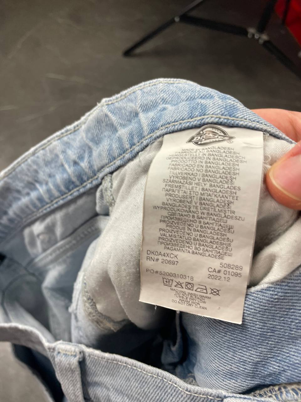 Dickies light blue denim carpenter shorts with logo button, multiple pockets, and hammer loop.