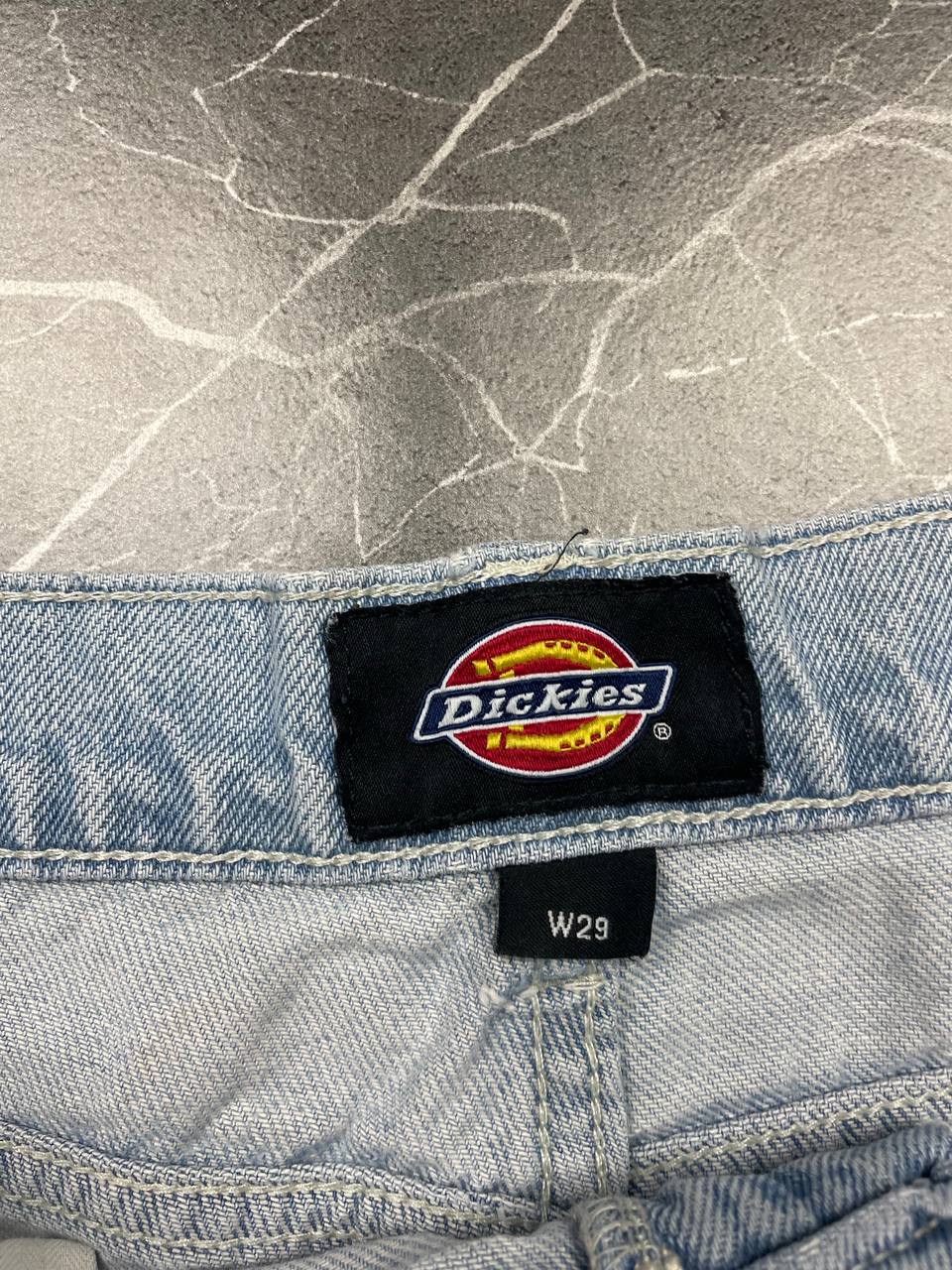 Dickies light blue denim carpenter shorts with logo button, multiple pockets, and hammer loop.