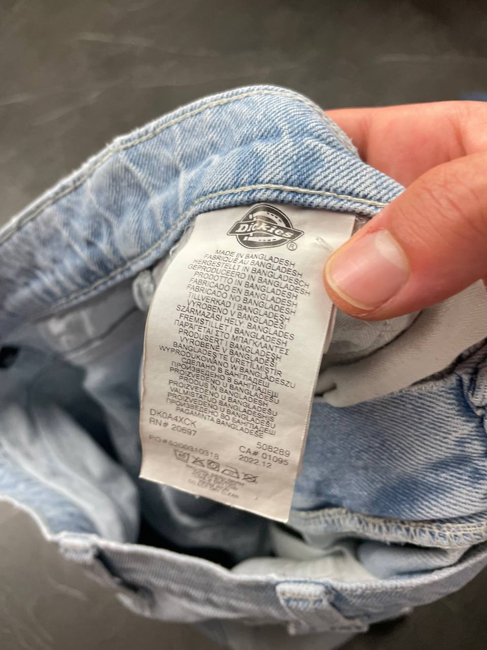 Dickies light blue denim carpenter shorts with logo button, multiple pockets, and hammer loop.