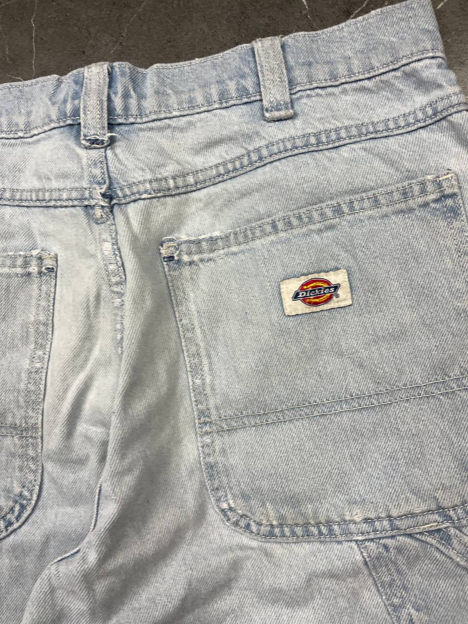 Dickies light blue denim carpenter shorts with logo button, multiple pockets, and hammer loop.