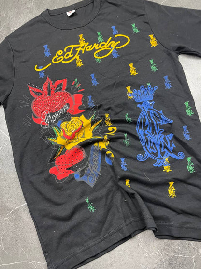 Ed Hardy black graphic t-shirt featuring colorful motifs and signature logo on front.
