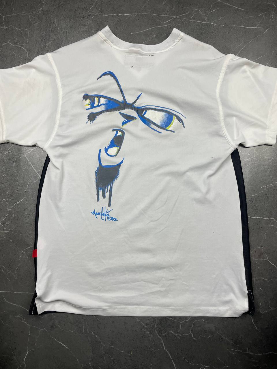 Ecko Unltd black vintage graphic t-shirt with white V-neck collar and blue face design.