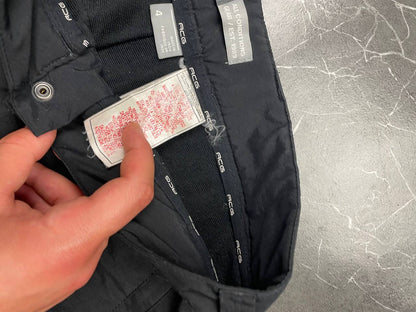 Nike black ACG outdoor pants, waterproof nylon, zip and button closure, zipped side pockets.