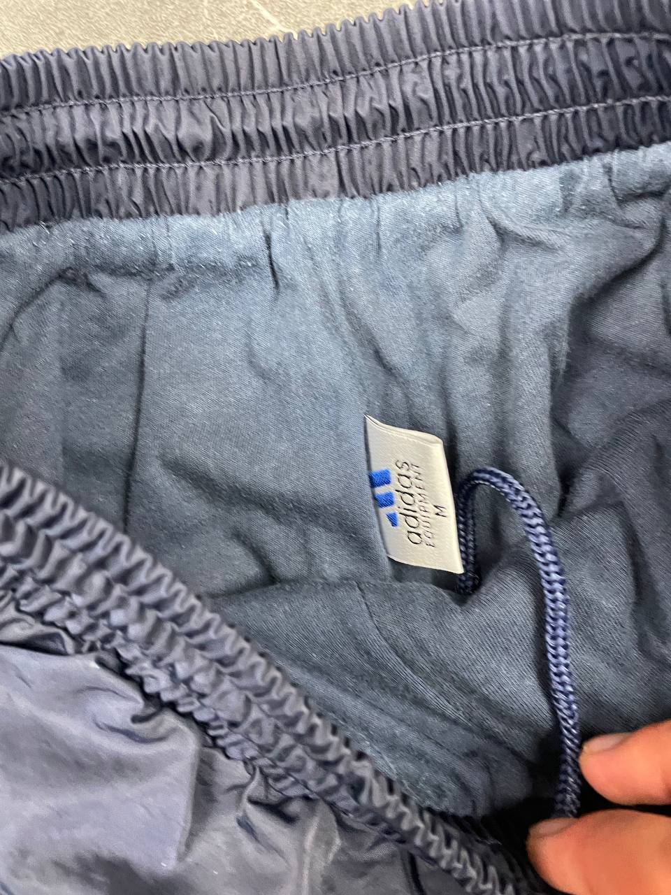 Adidas girls tracksuit navy blue with white stripes, full zip jacket and elastic pants.