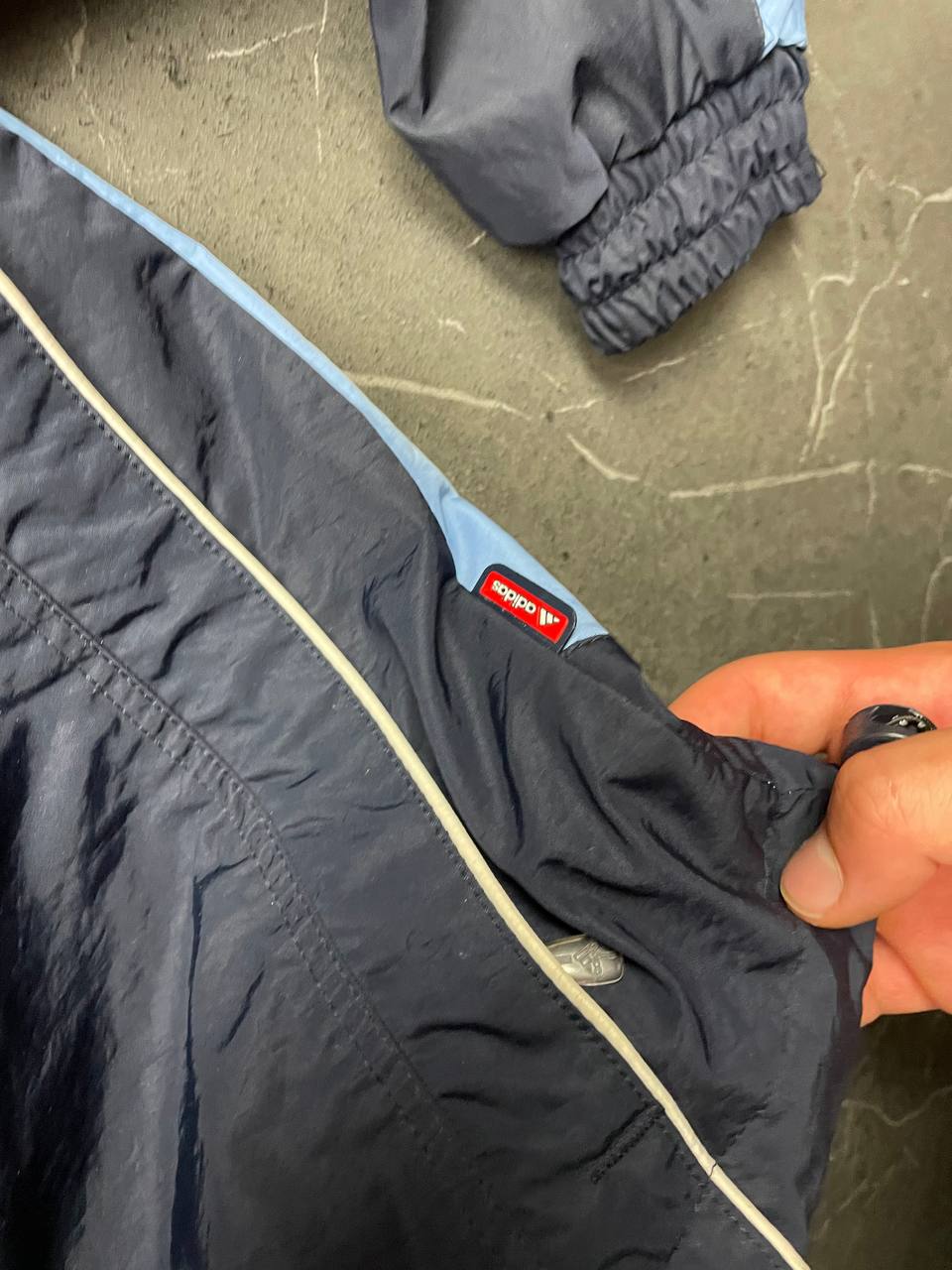 Adidas girls tracksuit navy blue with white stripes, full zip jacket and elastic pants.