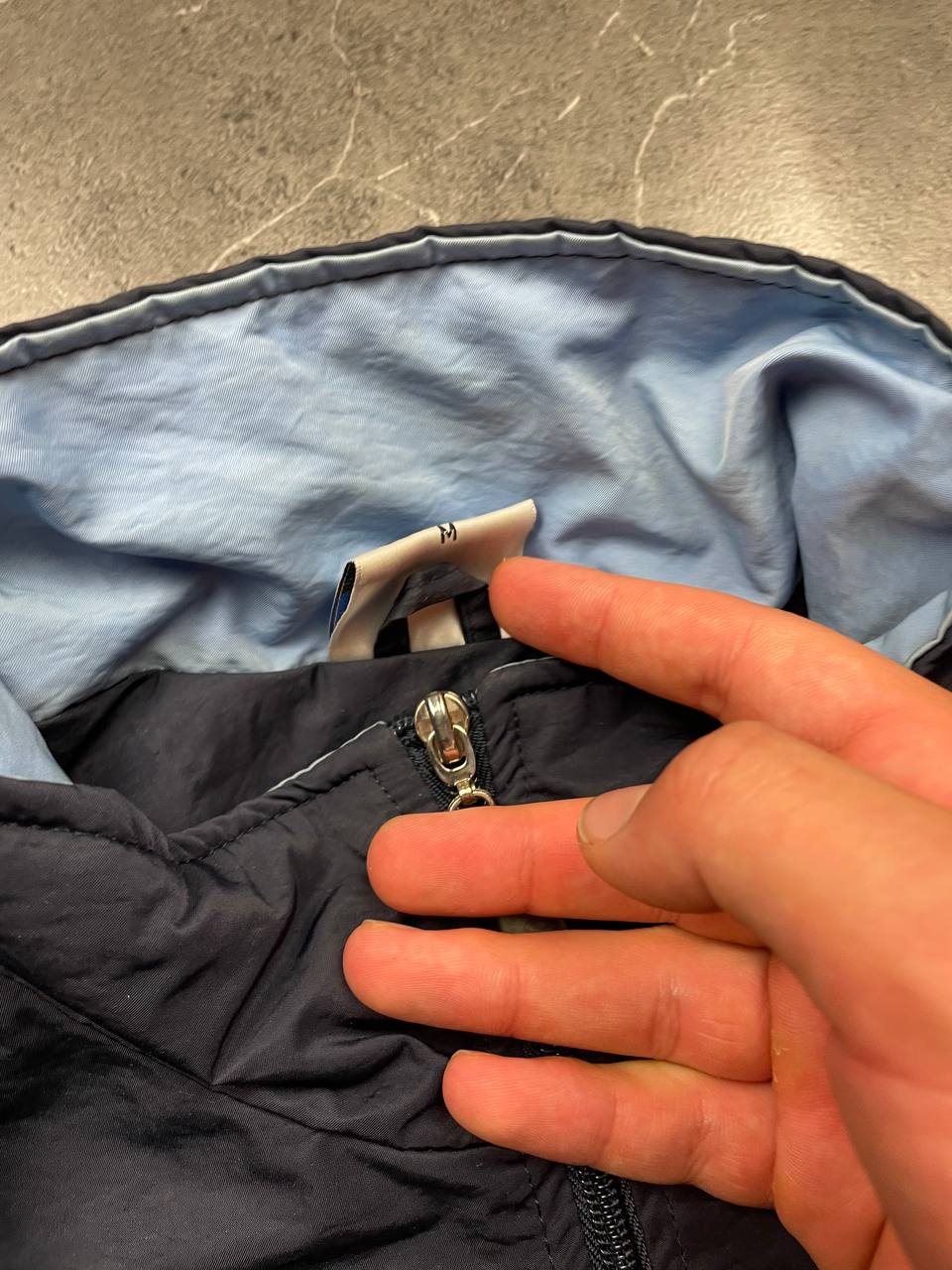 Adidas girls tracksuit navy blue with white stripes, full zip jacket and elastic pants.