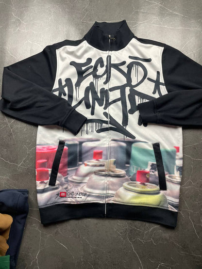 Ecko Unltd black zip-up jacket with graffiti print and spray paint can details.