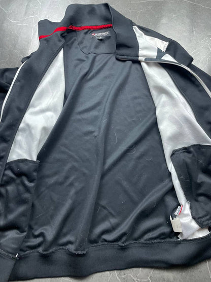 Ecko Unltd black zip-up jacket with graffiti print and spray paint can details.