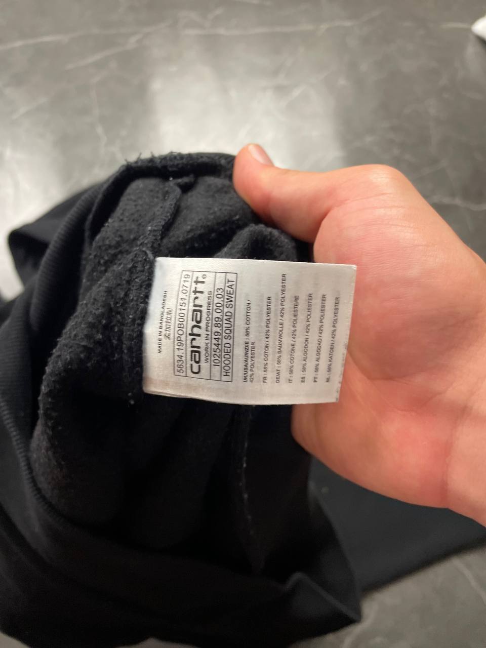 Carhartt black hooded sweatshirt small embroidered logo and front kangaroo pocket.