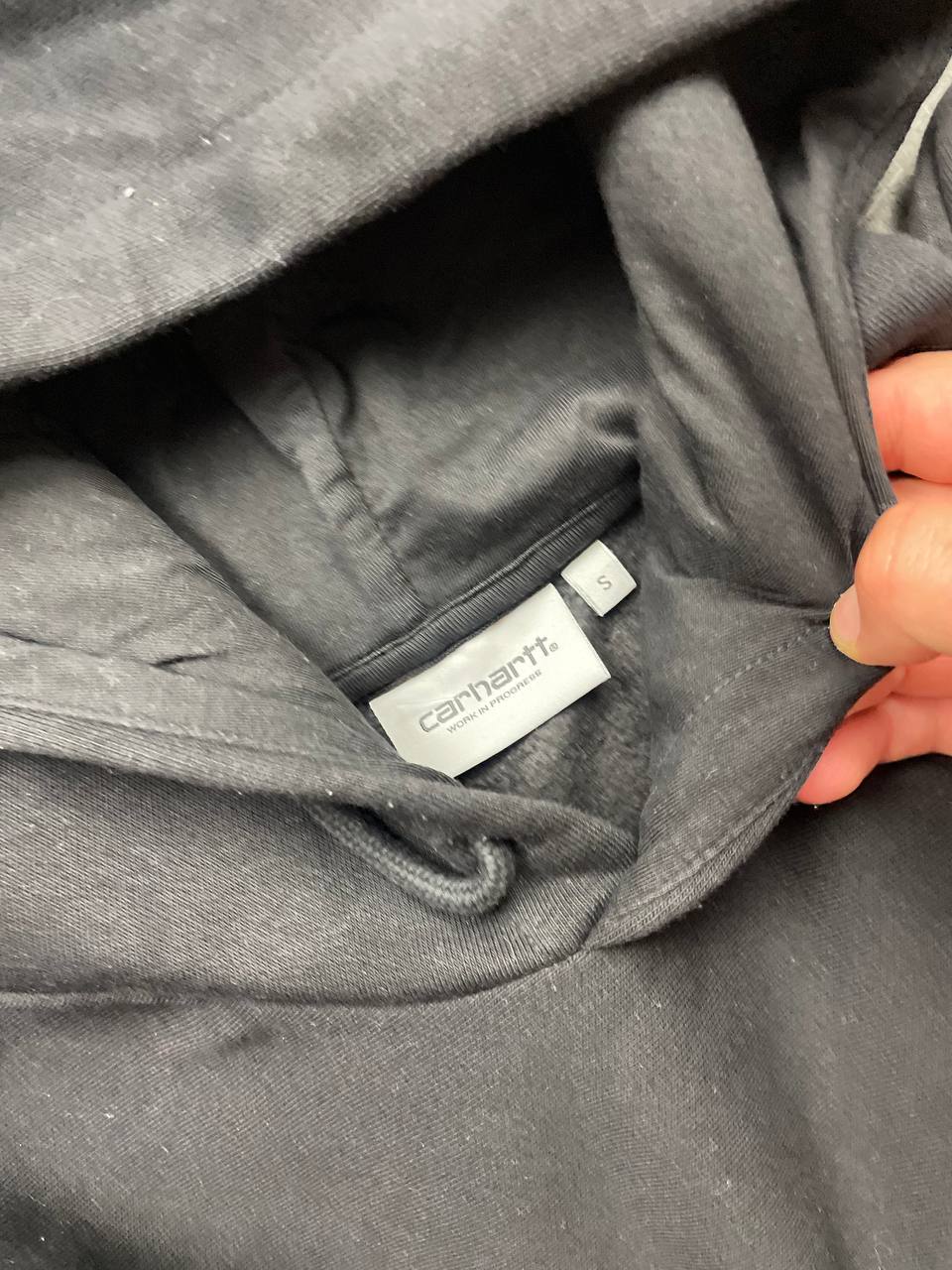 Carhartt black hooded sweatshirt small embroidered logo and front kangaroo pocket.