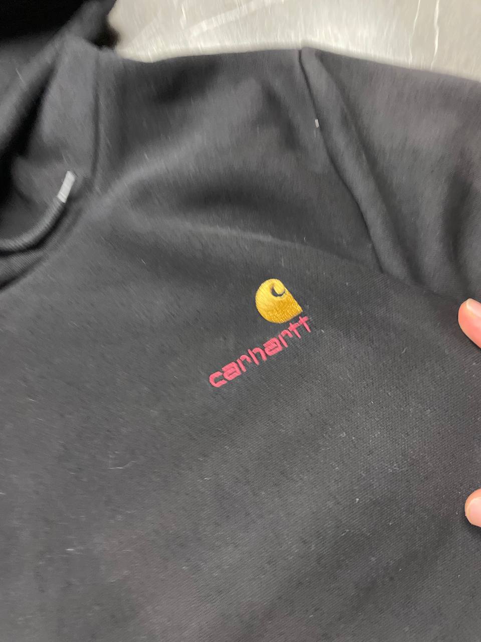 Carhartt black hooded sweatshirt small embroidered logo and front kangaroo pocket.