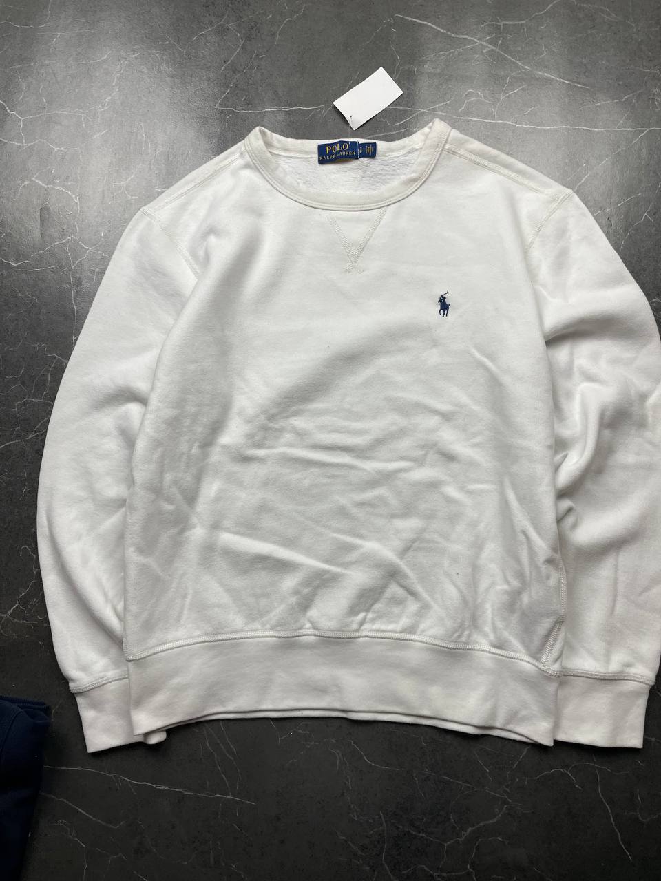 Polo Ralph Lauren navy sweatshirt with white embroidered logo and ribbed cuffs.