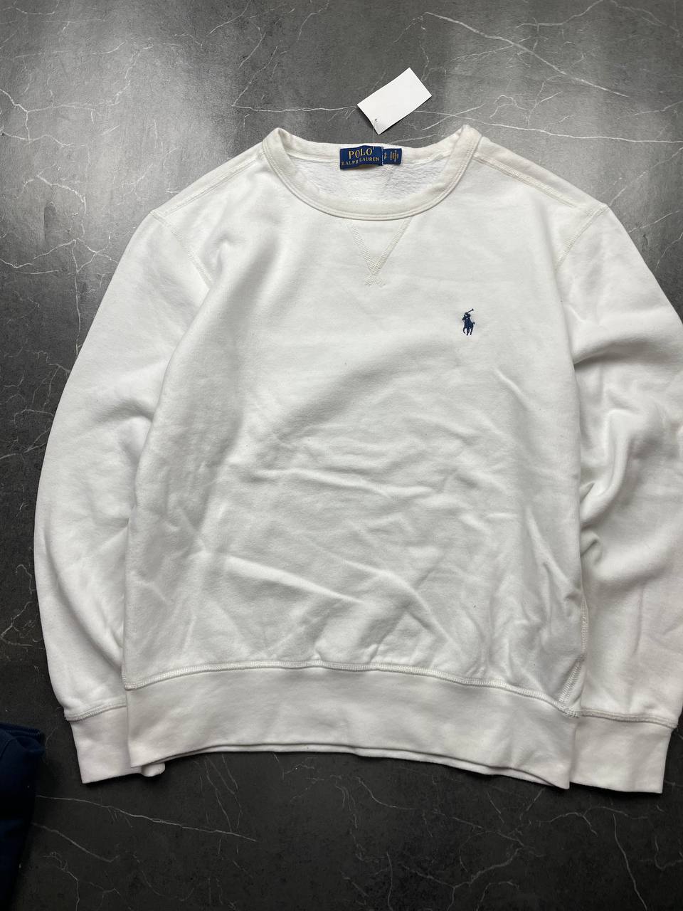 Polo Ralph Lauren navy sweatshirt with white embroidered logo and ribbed cuffs.