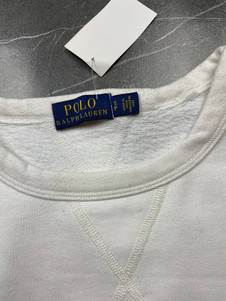 Polo Ralph Lauren navy sweatshirt with white embroidered logo and ribbed cuffs.