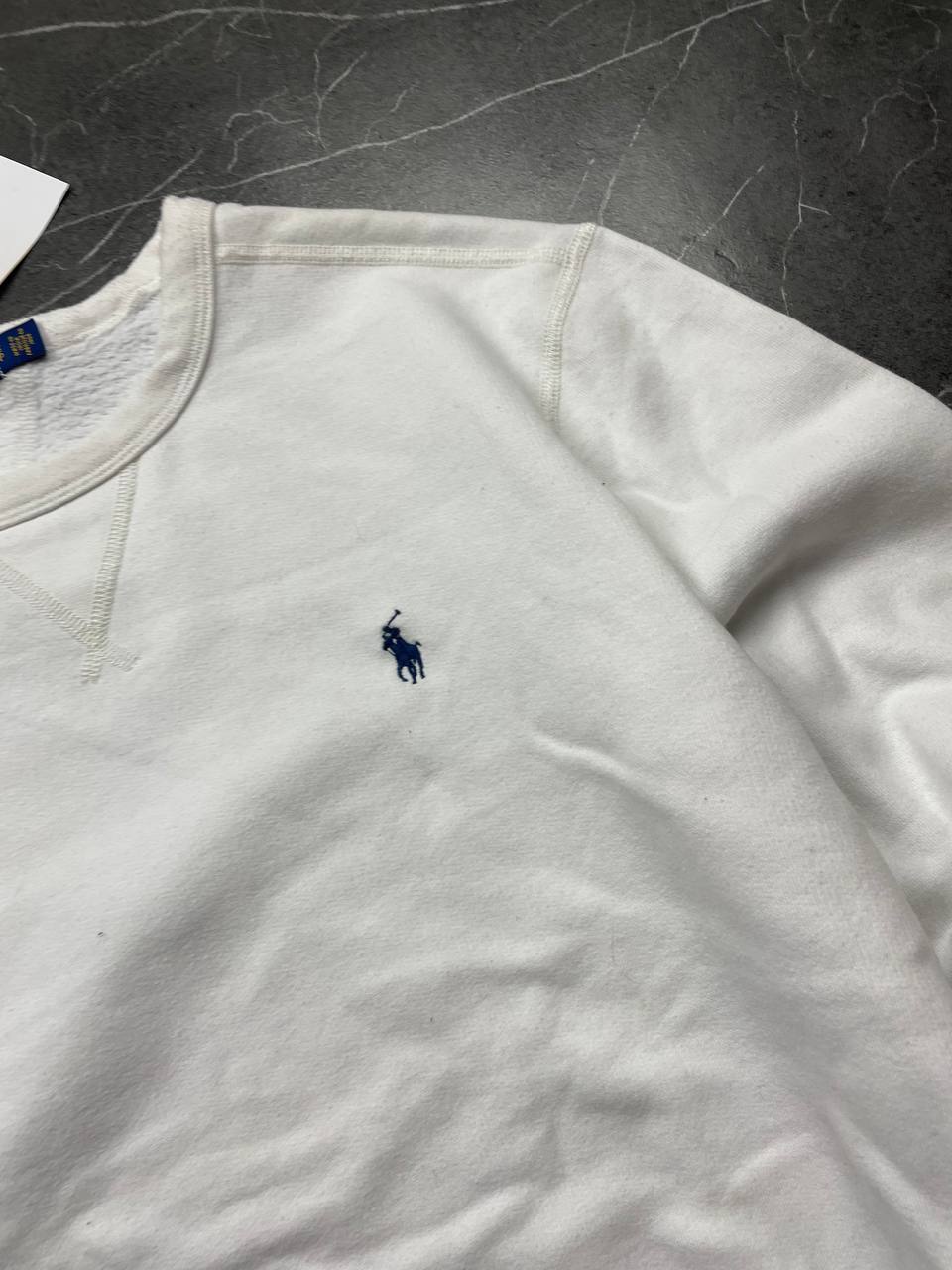 Polo Ralph Lauren navy sweatshirt with white embroidered logo and ribbed cuffs.