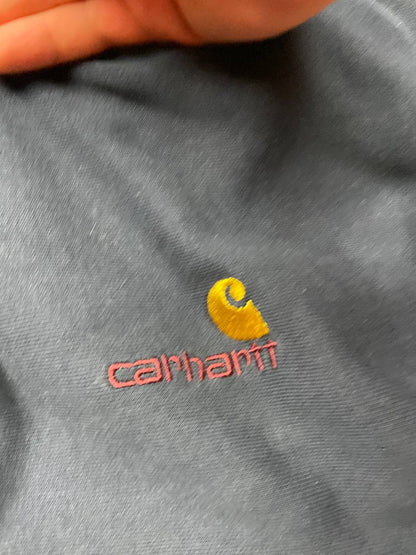 Carhartt navy hooded sweatshirt with American script logo on front left chest.