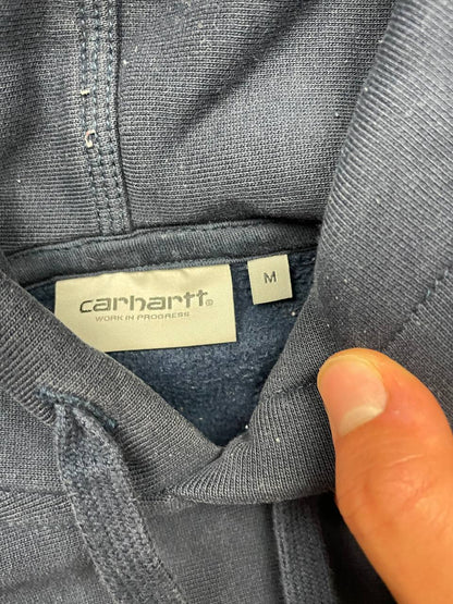 Carhartt navy hooded sweatshirt with American script logo on front left chest.