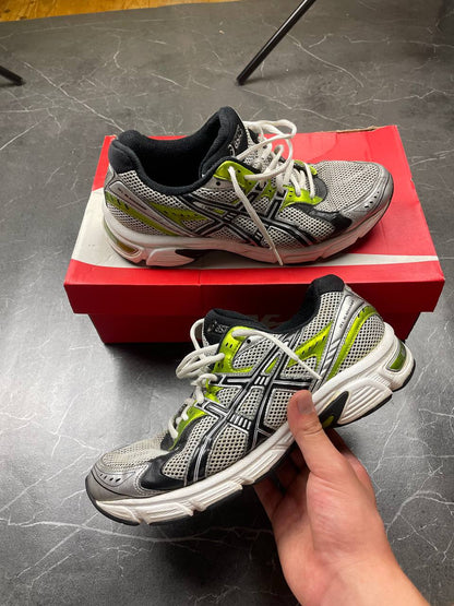 ASICS running shoes black white lime green synthetic upper rubber sole with visible wear