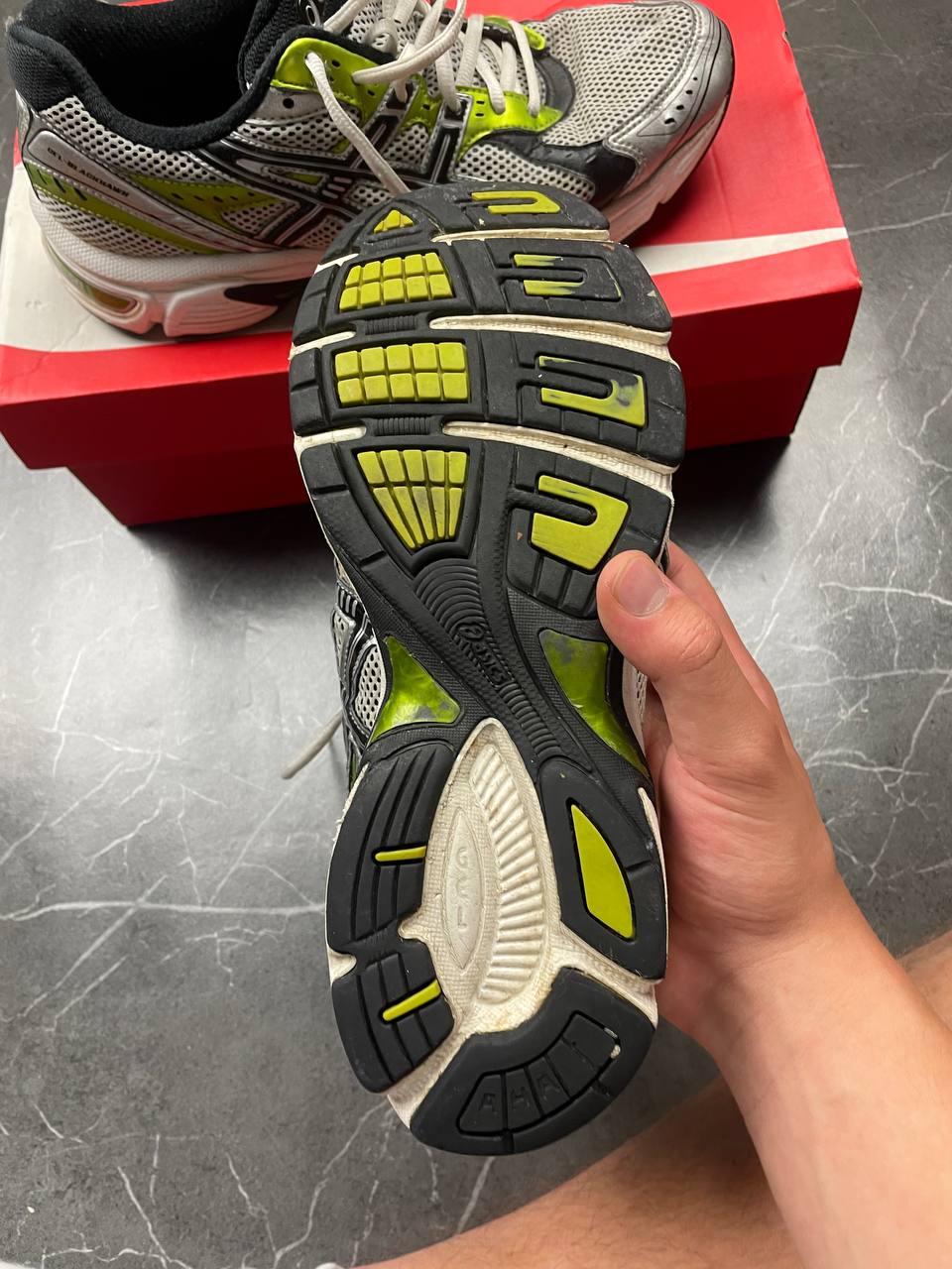 ASICS running shoes black white lime green synthetic upper rubber sole with visible wear