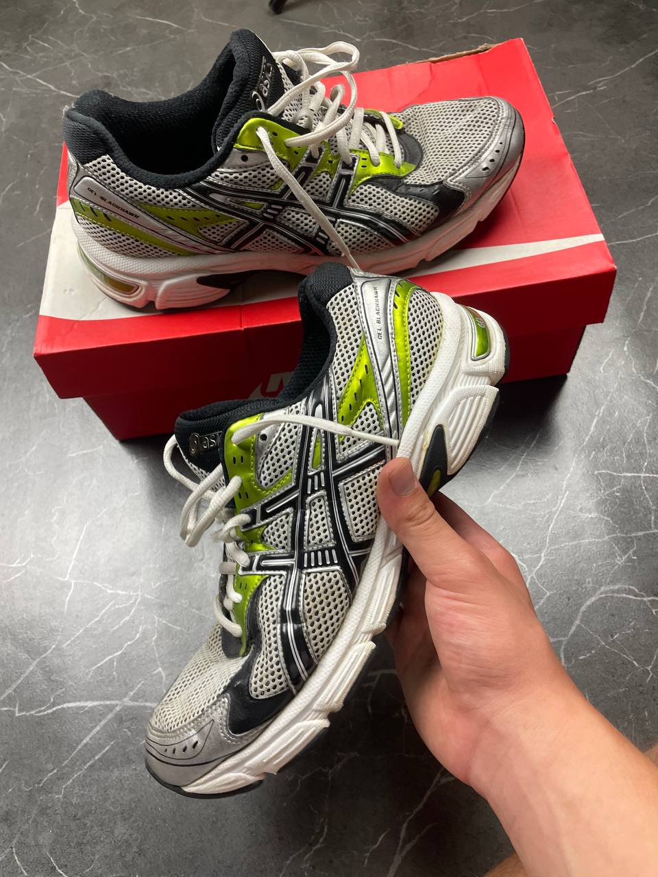 ASICS running shoes black white lime green synthetic upper rubber sole with visible wear