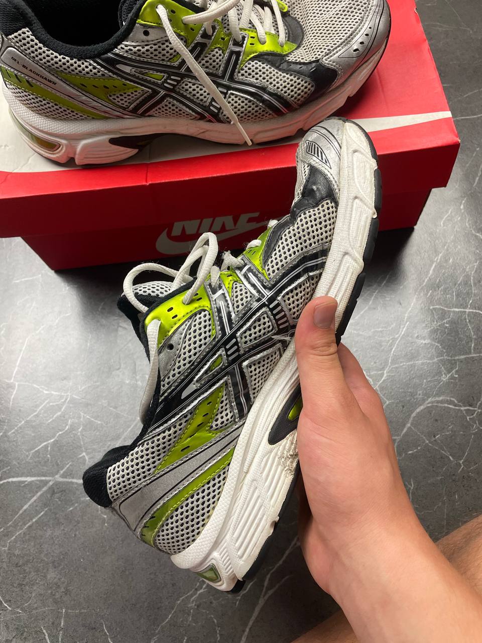 ASICS running shoes black white lime green synthetic upper rubber sole with visible wear