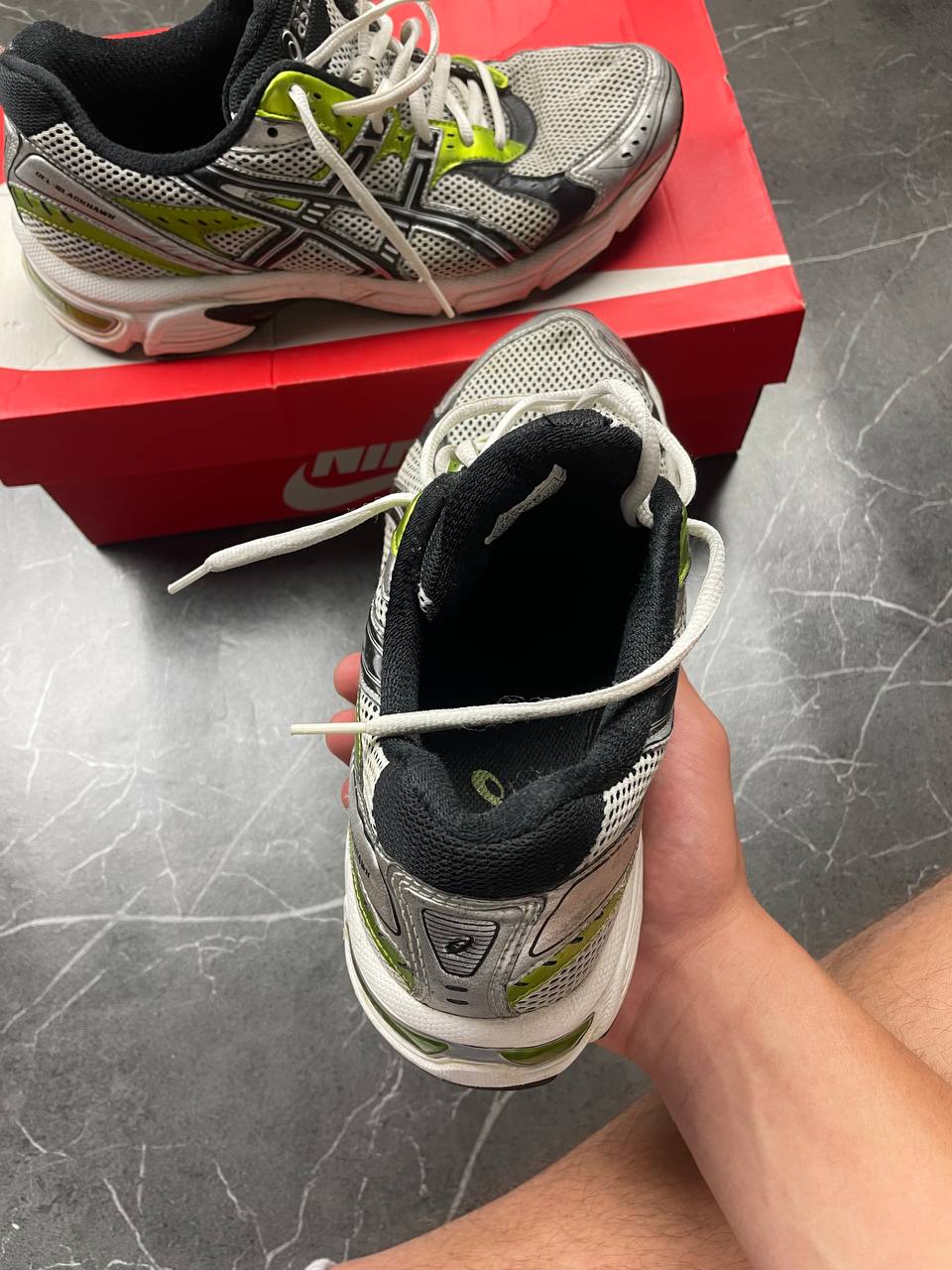 ASICS running shoes black white lime green synthetic upper rubber sole with visible wear