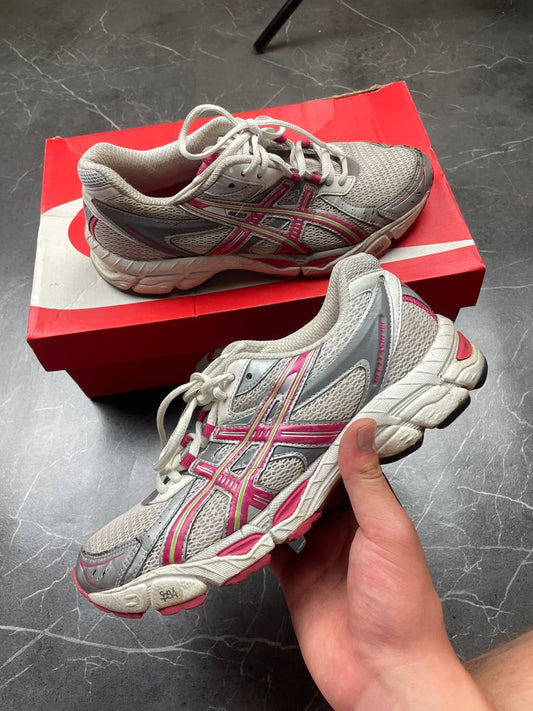 ASICS grey and pink running shoes with breathable mesh panels and rubber soles.