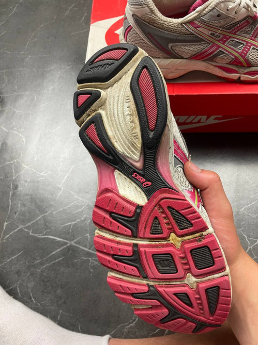 ASICS grey and pink running shoes with breathable mesh panels and rubber soles.