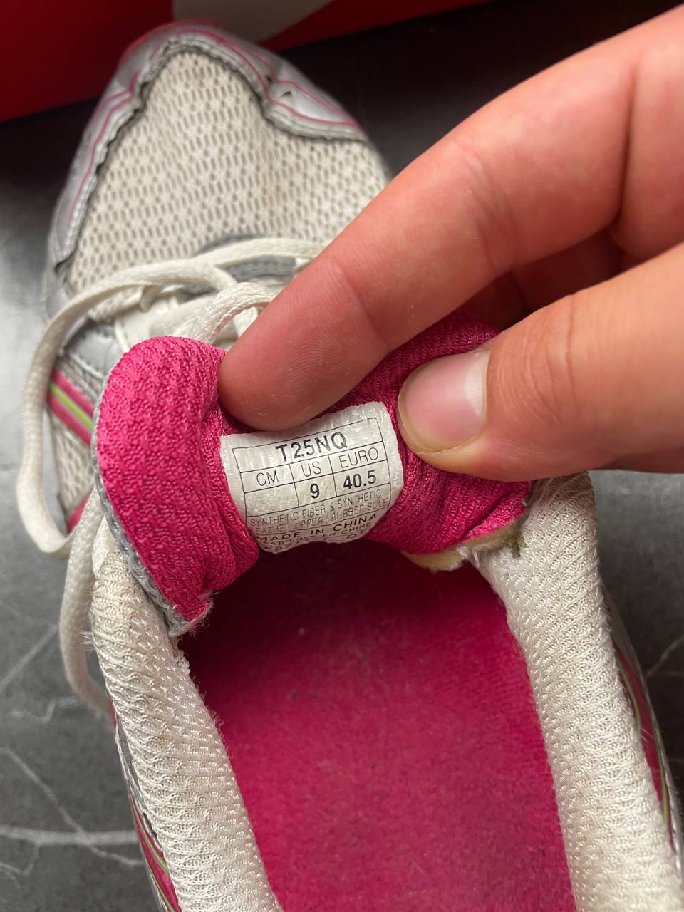 ASICS grey and pink running shoes with breathable mesh panels and rubber soles.