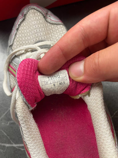 ASICS grey and pink running shoes with breathable mesh panels and rubber soles.