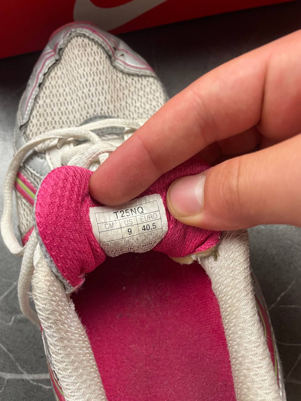 ASICS grey and pink running shoes with breathable mesh panels and rubber soles.