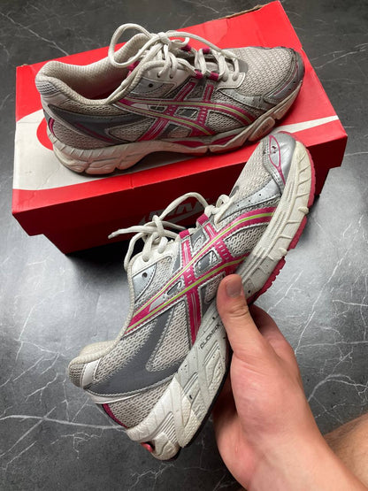 ASICS grey and pink running shoes with breathable mesh panels and rubber soles.