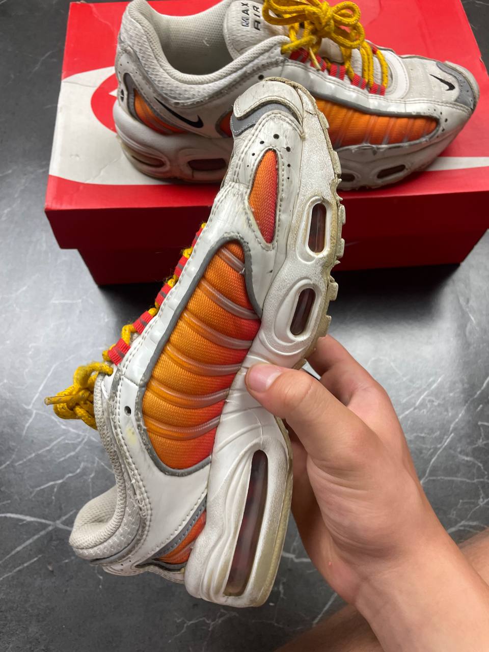 Nike Air Max Tailwind IV sneakers white base orange side panels yellow laces red eyelets