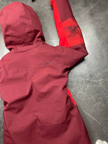 Oakley burgundy and red waterproof jacket with patterned accents and adjustable hood.