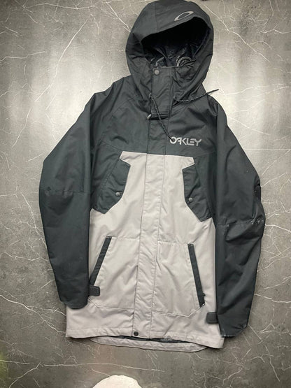 Oakley insulated hooded jacket black and grey with logo on chest and hood.