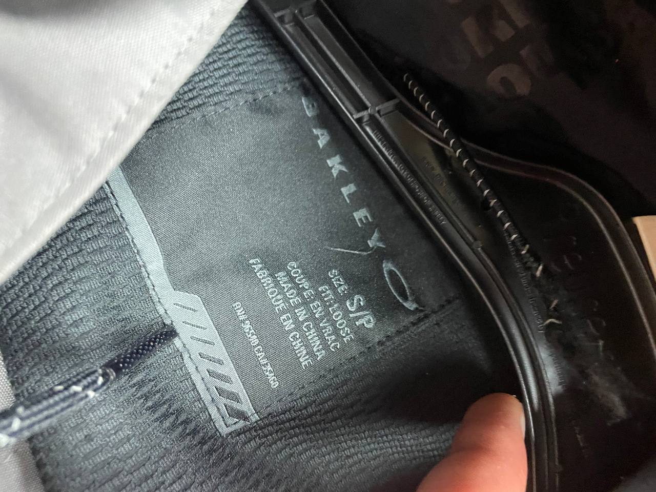 Oakley insulated hooded jacket black and grey with logo on chest and hood.