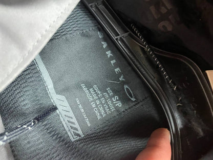 Oakley insulated hooded jacket black and grey with logo on chest and hood.
