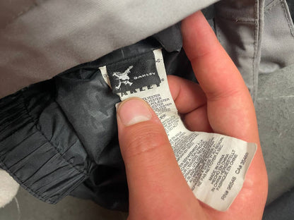 Oakley insulated hooded jacket black and grey with logo on chest and hood.