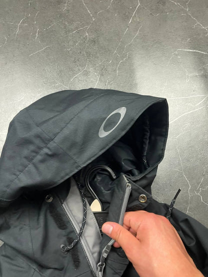 Oakley insulated hooded jacket black and grey with logo on chest and hood.
