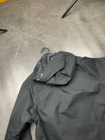 Oakley insulated hooded jacket black and grey with logo on chest and hood.